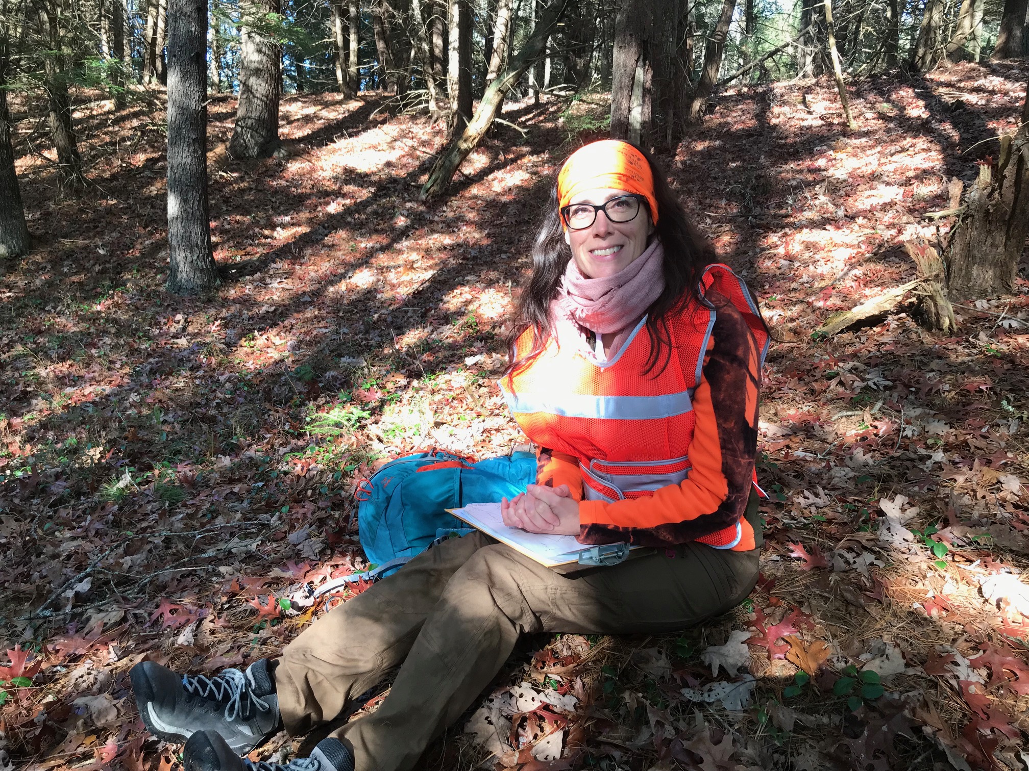 Christine surveying woodlot in Hubbardston Massachusetts